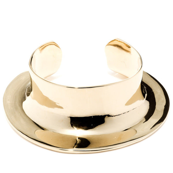 Gold cuff bracelet on a white background
